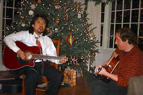 John and Rey play guitar